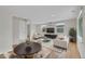 Bright living room featuring hardwood floors, neutral walls, and recessed lighting at 1720 Trenton St, Denver, CO 80220