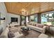 Cozy living room boasts wood ceilings, hardwood floors and plenty of natural light at 1720 Trenton St, Denver, CO 80220