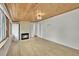 Living room boasts hardwood floors, fire place, and a wood ceiling at 1720 Trenton St, Denver, CO 80220