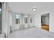 Bright sun room with walls of windows overlooking the backyard at 1720 Trenton St, Denver, CO 80220