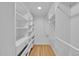 Walk-in closet with custom shelving and built-in drawers offers ample storage space at 1720 Trenton St, Denver, CO 80220