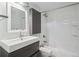 Modern bathroom with sleek vanity, updated fixtures, and a tiled shower-tub combo at 720 16Th St # 306, Denver, CO 80202