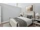 Cozy bedroom with a neutral color palette, a comfortable bed and stylish bedside tables at 720 16Th St # 306, Denver, CO 80202
