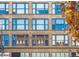 Exterior facade with classic architectural details and reflected building in windows at 720 16Th St # 306, Denver, CO 80202