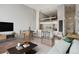 Stylish open-concept living and dining area with modern furnishings and sleek finishes at 720 16Th St # 306, Denver, CO 80202