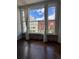 Charming views through large windows showcase the historic brick building, hardwood floors, and bright light at 720 16Th St # 306, Denver, CO 80202
