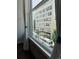 Cityscape views through large windows; a glimpse of downtown and rail car at 720 16Th St # 306, Denver, CO 80202