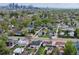 Aerial view of a residential neighborhood with city skyline in the background at 2235 W 46Th Ave, Denver, CO 80211