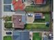 Bird's-eye view of property with green lawn, solar panels, driveway, and neighboring houses at 2235 W 46Th Ave, Denver, CO 80211