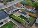 Aerial view of the property, with a fenced backyard, detached garage and solar panels at 2235 W 46Th Ave, Denver, CO 80211