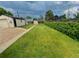 Lush backyard featuring a storage shed, garage and a green privacy hedge at 2235 W 46Th Ave, Denver, CO 80211