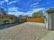 Backyard features a detached garage, gravel parking, patio and lawn at 2235 W 46Th Ave, Denver, CO 80211