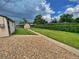 Serene backyard with lush lawn, mature trees, and a convenient storage shed at 2235 W 46Th Ave, Denver, CO 80211