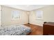 Bright bedroom with hardwood floors, ample natural light, and a cozy bed at 2235 W 46Th Ave, Denver, CO 80211