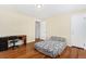 Bedroom featuring hardwood floors, and a comfortable bed, creating a cozy retreat within the home at 2235 W 46Th Ave, Denver, CO 80211