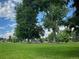 Large, open green space at Chaffee Park featuring mature shade trees at 2235 W 46Th Ave, Denver, CO 80211