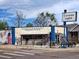 Exterior of Huckleberry Roasters, a local coffee shop with outdoor seating and colorful murals at 2235 W 46Th Ave, Denver, CO 80211