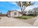 Charming single-story home featuring a well-maintained yard, long driveway, and a classic design at 2235 W 46Th Ave, Denver, CO 80211