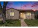 Charming single-story home with a well-maintained lawn and inviting front porch at 2235 W 46Th Ave, Denver, CO 80211