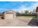 Detached garage with concrete driveway and gravel area, providing ample parking space at 2235 W 46Th Ave, Denver, CO 80211