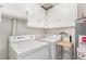 Laundry area featuring washer, dryer and storage space at 2235 W 46Th Ave, Denver, CO 80211