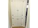 Traditional linen closet with painted white doors and burnished bronze hardware at 2235 W 46Th Ave, Denver, CO 80211