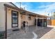 Back patio with an awning, grill, and space for outdoor seating at 2235 W 46Th Ave, Denver, CO 80211