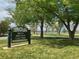 Rocky Mountain Lake Park sign with trees, green grass, and lake in the background at 2235 W 46Th Ave, Denver, CO 80211
