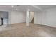 Spacious basement featuring neutral carpet, white walls, storage closet, and stairs at 8652 Aberdeen Cir, Highlands Ranch, CO 80130