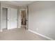 Bedroom with closet, neutral walls, and carpeting at 8652 Aberdeen Cir, Highlands Ranch, CO 80130