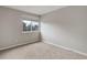 Bedroom with neutral walls, carpeting, and a window for natural light at 8652 Aberdeen Cir, Highlands Ranch, CO 80130