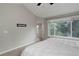 An airy main bedroom with a large window, and a neutral color palette at 8652 Aberdeen Cir, Highlands Ranch, CO 80130