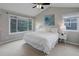 Bright main bedroom featuring a vaulted ceiling, ceiling fan, large windows and neutral decor at 8652 Aberdeen Cir, Highlands Ranch, CO 80130