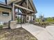 Exterior view of the community clubhouse entrance with stone columns and landscaping at 1373 E Witherspoon Dr, Elizabeth, CO 80107