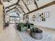 Clubhouse interior with seating, high ceilings, and decorative lighting fixtures at 1373 E Witherspoon Dr, Elizabeth, CO 80107