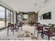 A common room with tables, chairs, a TV and a modern design at 1373 E Witherspoon Dr, Elizabeth, CO 80107
