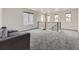 Upstairs loft area with soft gray carpet, natural light, and space for entertaining at 1373 E Witherspoon Dr, Elizabeth, CO 80107