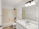 Well-lit full bathroom featuring tiled floors, a shower-tub combo, and a vanity at 11103 E Alameda Ave # 201, Aurora, CO 80012