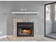 Cozy fireplace with decorative tile surround and a mantel sits on a gray wall at 11103 E Alameda Ave # 201, Aurora, CO 80012