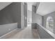 Bright open hallway with high ceilings and neutral carpeting and paint at 11103 E Alameda Ave # 201, Aurora, CO 80012