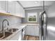 Efficient kitchen with stainless steel appliances and bright countertops at 11103 E Alameda Ave # 201, Aurora, CO 80012