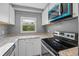 Well-lit kitchen features stainless steel appliances and laminate countertops at 11103 E Alameda Ave # 201, Aurora, CO 80012