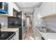 Compact kitchen featuring stainless steel appliances and durable countertops at 11103 E Alameda Ave # 201, Aurora, CO 80012