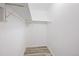 A bright walk-in closet with clean white walls and wooden flooring, offering ample storage space at 11103 E Alameda Ave # 201, Aurora, CO 80012
