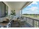 Cozy covered patio with outdoor seating, grill, and scenic views at 42994 Colonial Trl, Elizabeth, CO 80107