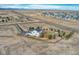 A high aerial view showing the property's expansive fenced lot in a rural setting at 600 Coyote Trl, Elizabeth, CO 80107