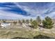 View of the expansive backyard featuring a play set and shed at 600 Coyote Trl, Elizabeth, CO 80107