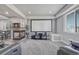 Finished basement includes a fireplace, movie screen, and comfortable seating at 600 Coyote Trl, Elizabeth, CO 80107