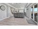 Finished basement features vinyl floors, recessed lighting, a movie screen, and a walk-out patio at 600 Coyote Trl, Elizabeth, CO 80107
