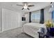 Comfortable bedroom featuring plush carpeting, ceiling fan, closet, and a bright window at 600 Coyote Trl, Elizabeth, CO 80107